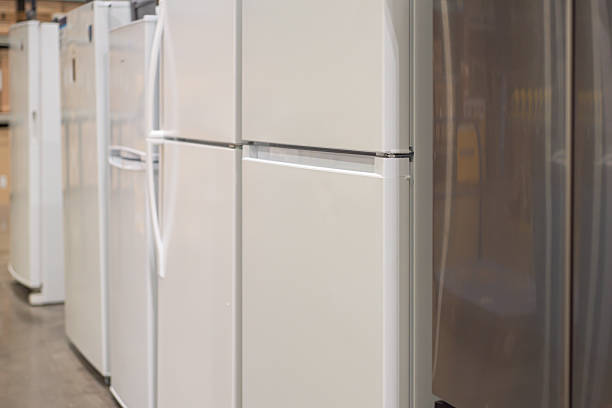 istock Compact refrigerators in white and stainless-steel finishes on display at retail aisle hardware home improvement store in Dallas, Texas. Price tags, energy guide and product labels visible 2235174349