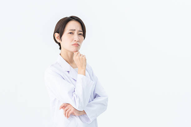 istock Middle-aged Japanese woman in a white coat 2235177781