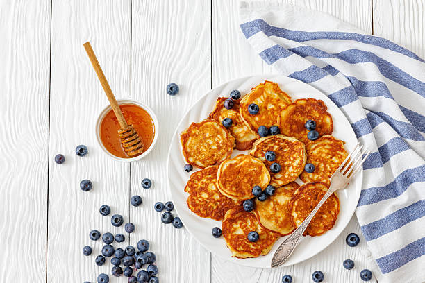 istock fried hot and crispy pancakes with blueberries 2235178566