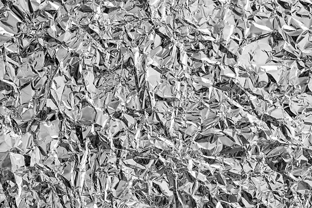istock Shiny metal silver gray foil leaf crumpled texture background 2235185166