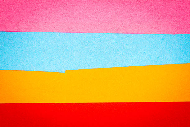 Multi color background from a paper of different colors. Abstract colorful vibrant textures paper.