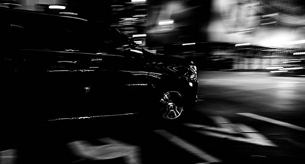 istock BLACK CAR IN BLURRED MOTION: NIGHT RUSH HOUR IN TORONTO, CANADA 2235186065