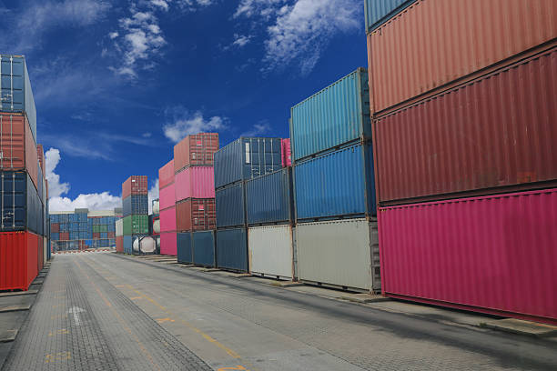 The containers are stacked in distribution warehouse.Export logistics shipping transportation concept