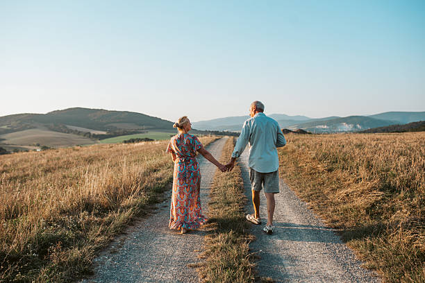 istock Senior couple on walk during sunset. 2235190477