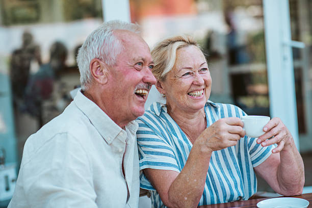 istock Smiling elderly couple enjoying coffee together in the garden. 2235190864