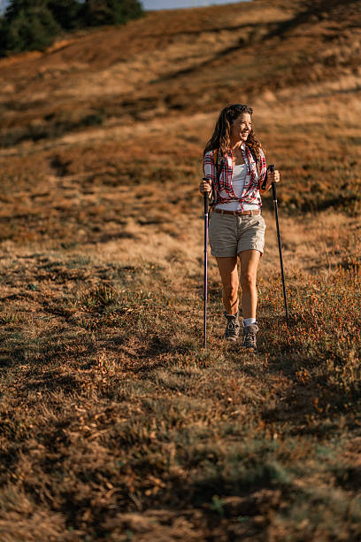 istock Young woman hiking on a mountain 2235192960