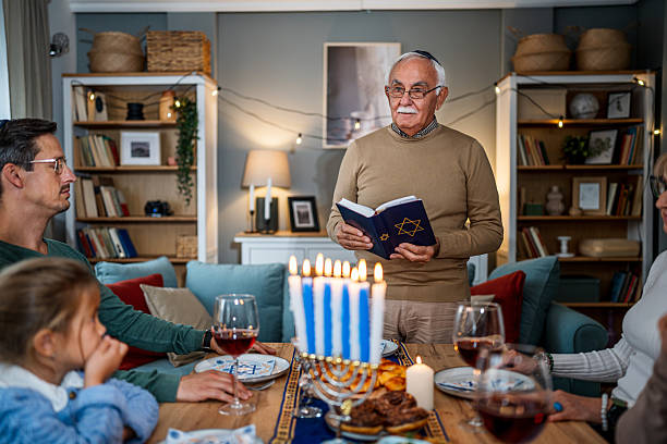 istock Extended family celebrating Hanukkah with traditional dinner 2235194290