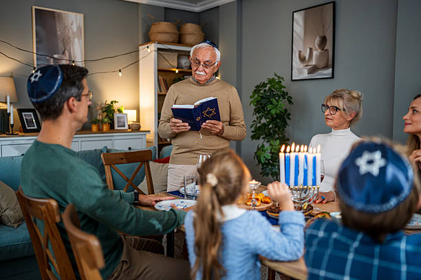 istock Extended family celebrating Hanukkah with traditional dinner 2235194366