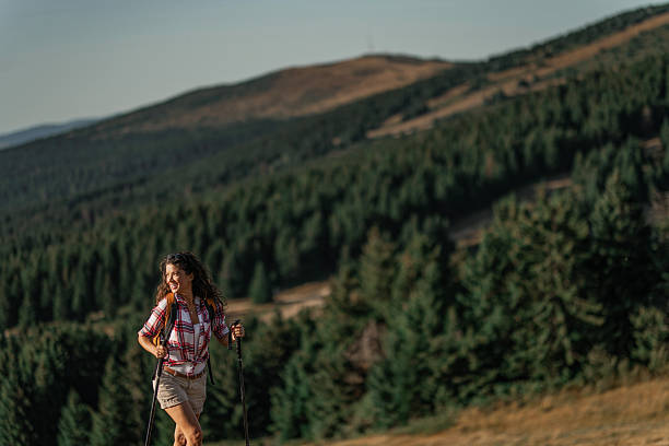 istock Young woman hiking on a mountain 2235194414