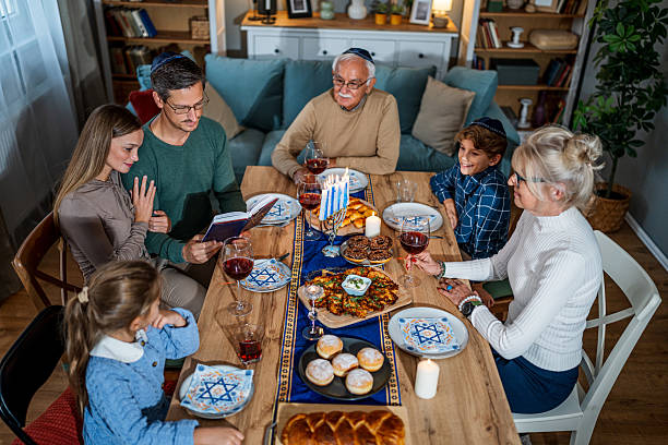 istock Extended family celebrating Hanukkah with festive dinner 2235195265