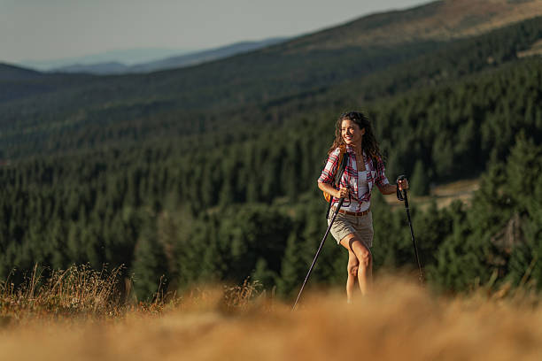 istock Young woman hiking on a mountain 2235195330