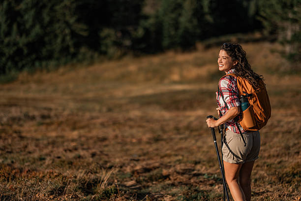 istock Young woman hiking on a mountain 2235195501