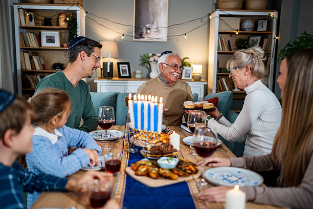 istock Extended family celebrating Hanukkah with festive dinner 2235196238