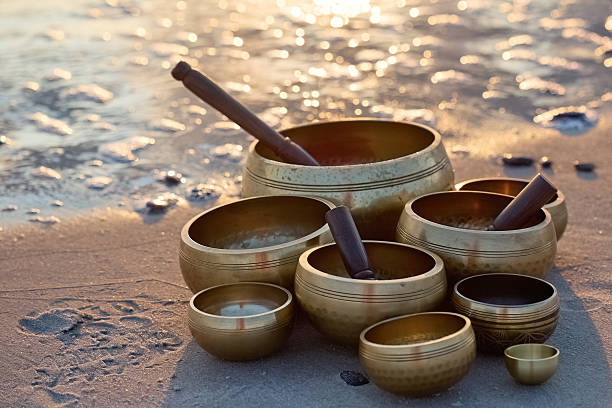 istock Singing Bowls on Beach at sunrise. 2235197529