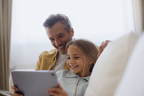 istock Father and Daughter Enjoying Tablet Time Together 2235198295