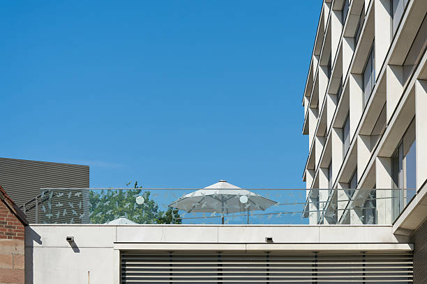 istock residential building with terrace and parasol 2235198884