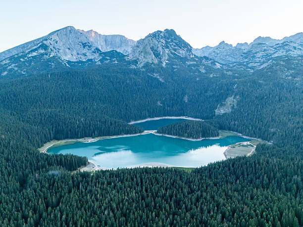 istock Mountain Lakes Surrounded by Dense Forests 2235203515