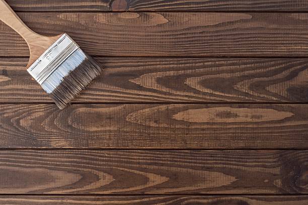 istock Hand Painting Wood with Brush 2235204171