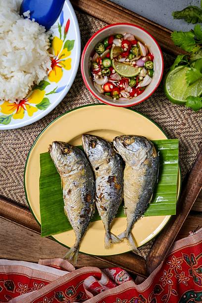 Fried mackerel with thai spicy chilli fish sauce and rice