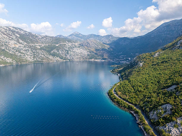 istock Mountain Sea with Boat and Coastal Road 2235206304
