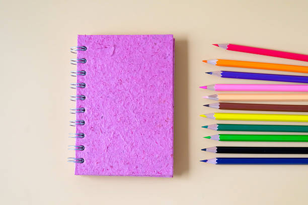 istock Home made Pink notebook on color background. 2235207417
