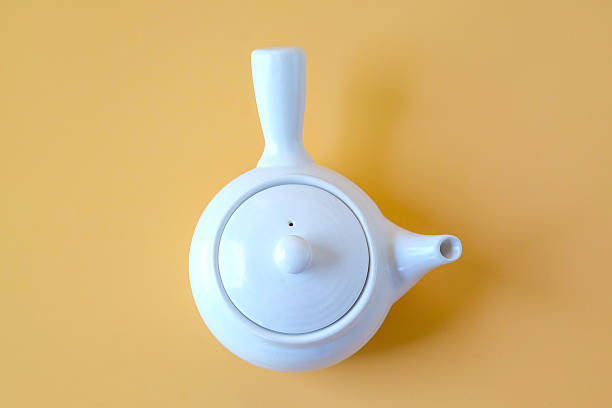 Chinese ceramic teapot on red background