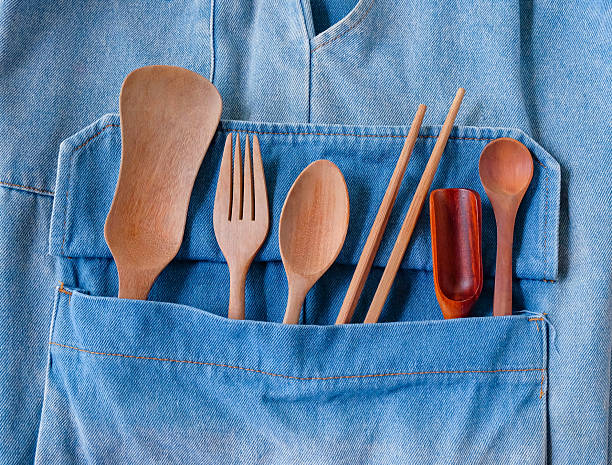 istock Wood fork and spoon in pocket jean. kitchen utensil. 2235207779