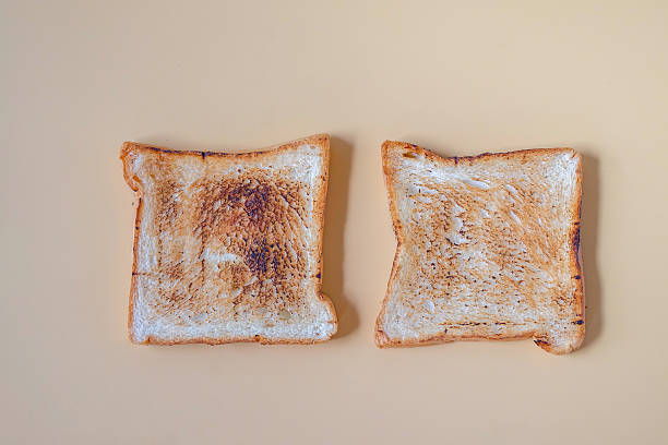 istock Slices of freshly toasted bread on color background. 2235208287
