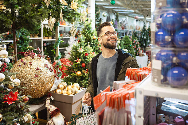 istock Holiday shopping man with bags 2235215540