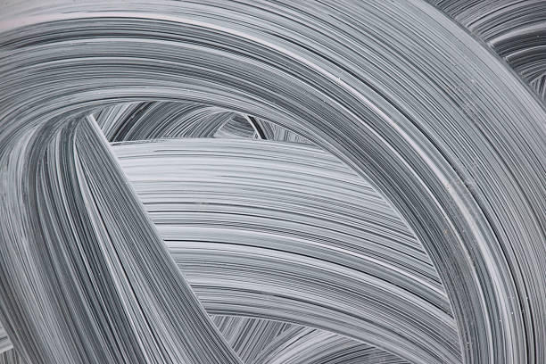 Abstract white background comprised of Windolene curves on glass windows