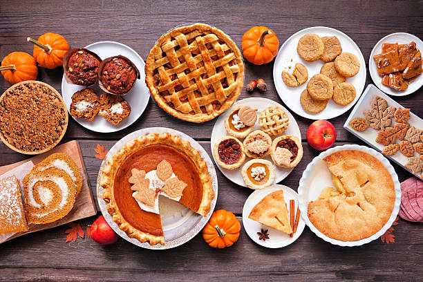istock Autumn desserts table scene. Top down view over a dark wood background. 2235221926