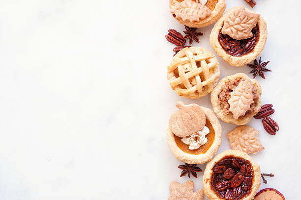 istock Fall pie theme dessert side border against a white marble background 2235222223