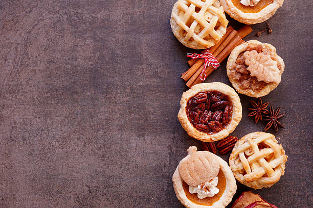 istock Autumn pie theme dessert side border against a dark stone background 2235222228