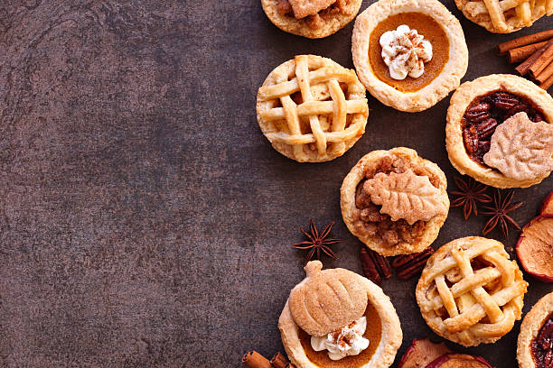 istock Autumn pie theme dessert side border against a dark stone background 2235222237