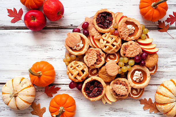 istock Fall pie theme dessert board. Top down view table scene against a white wood background. 2235222247