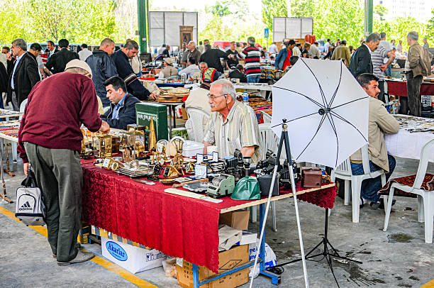 A variety of ceramic figurines on a flea market - selective focus on front