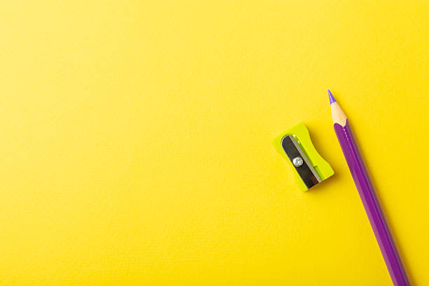 istock Pencil sharpener on bright colored background. Pencil and pencil shavings. Stationery. School supplies. School products. Flat lay. Place for text. copy space. 2235224704