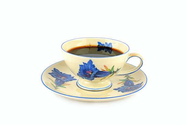 Top view of empty white coffee cup place on surface many roasted coffee beans background.