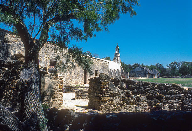 istock San Antonio Missions NHP - Mission San Juan & Tree - 1984 2235231942