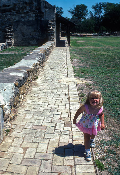 istock San Antonio Missions NHP - Girl on Sidewalk - 1984 2235232148