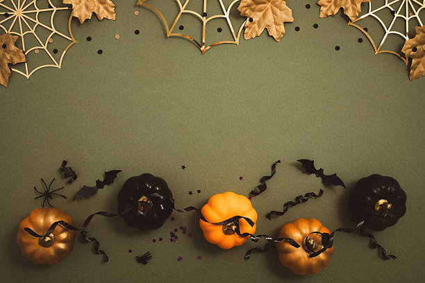 istock Happy halloween background with party decorations from pumpkins, bats, spiderweb top view. Mystic autumn holiday greeting card concept. 2235234633