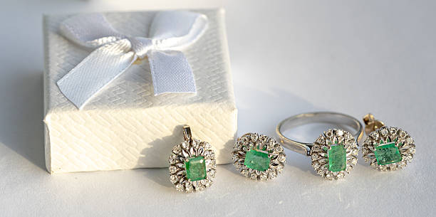 Luxury white gold ring with emerald and diamonds. Jewellery