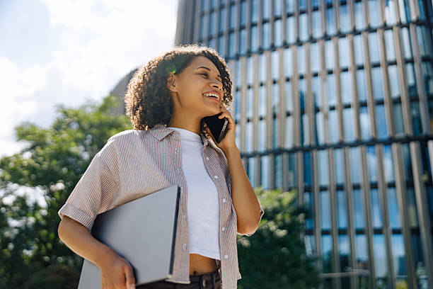 istock A Young Professional Actively Engaged in a Work Call While Outdoors in a Beautiful Environment 2235244784
