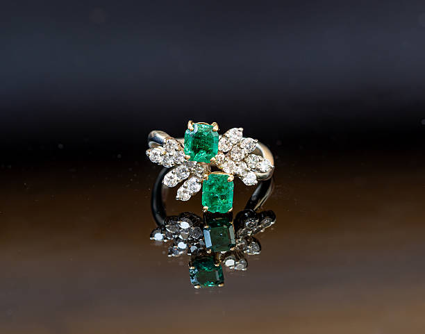Beautiful Ring with Green Emerald and Gold Metal - 3D Illustration Render