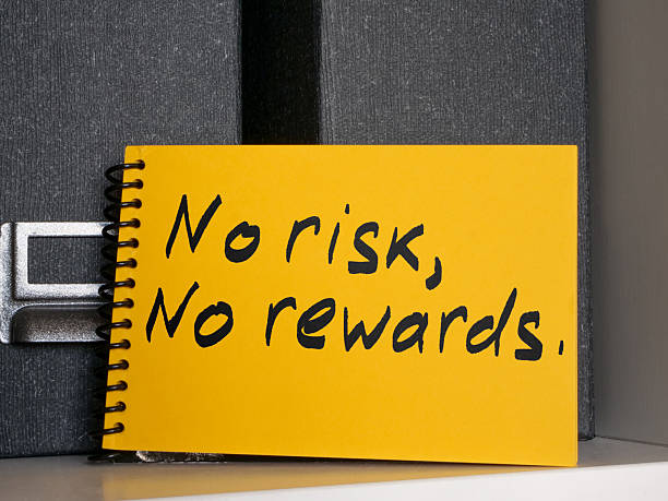 istock Notepad with a phrase no risk, no rewards on an office shelf. 2235245854