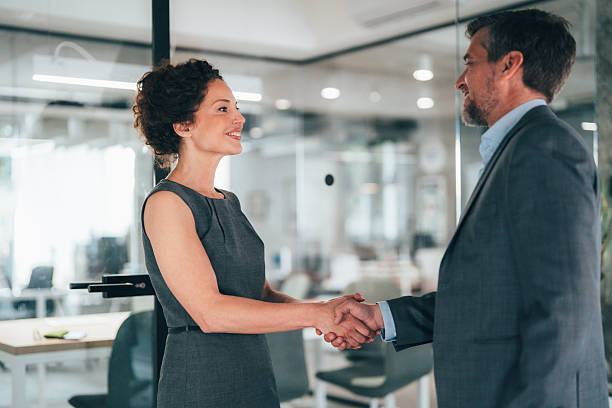 istock Successful business agreement sealed with a handshake in modern office 2235246494