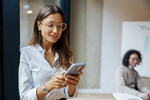 istock A Young Professional Engaging with Their Smartphone in a Modern and Stylish Office Environment 2235246744