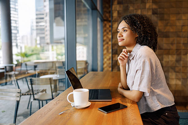 istock Contemplative Woman in a Modern Caf Setting 2235247237