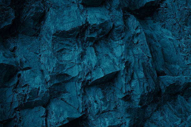 istock Black dark blue turquoise stone rock texture background. Toned rocky surface mountain. Close-up. Nature. For design. 2235249007