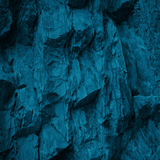 istock Black dark blue turquoise stone rock texture background. Toned rocky surface mountain. Close-up. Nature. For design. 2235249012